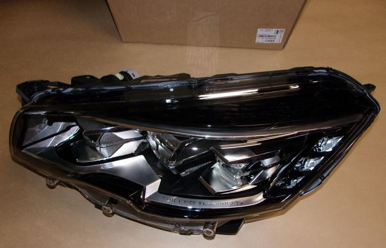 Reflektor Peugeot 508 lewy