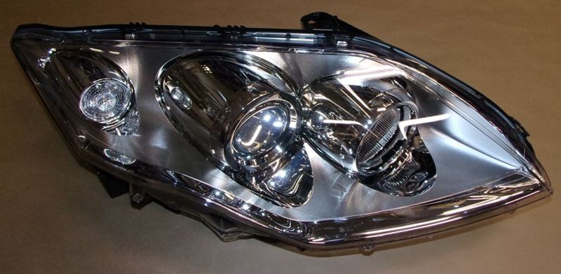Reflektor Renault Laguna III prawy chrom