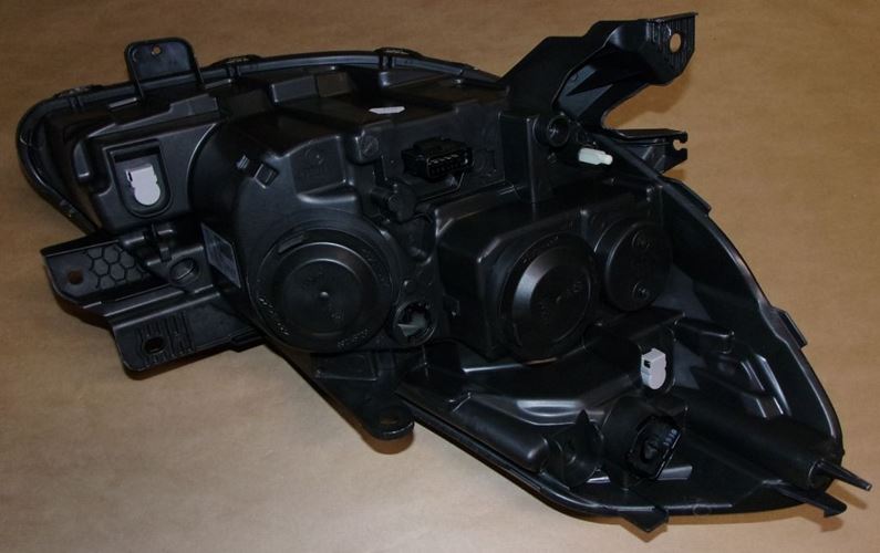 Reflektor Renault Clio III czarny lewy