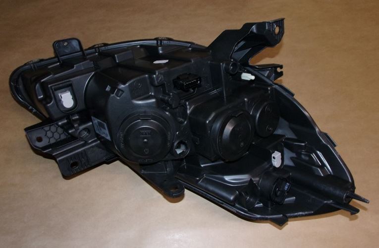 Reflektor Renault Clio III czarny lift lewy