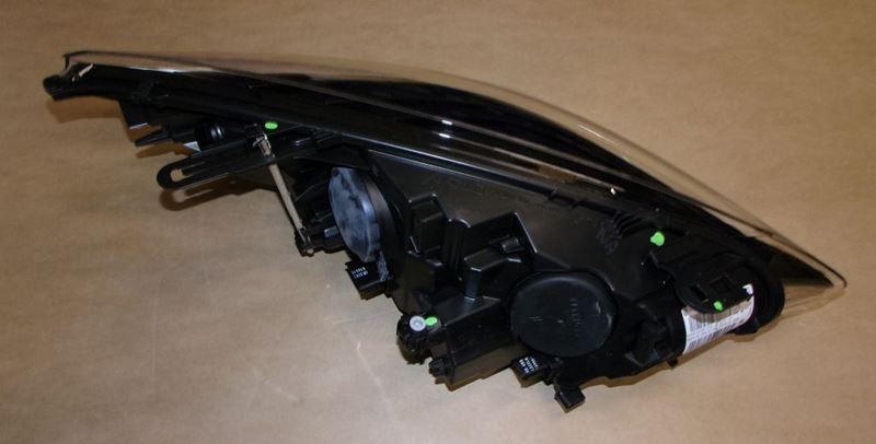 Reflektor Renault Megane III Coupe lewy
