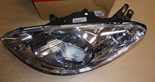 Reflektor Peugeot 1007 lewy
